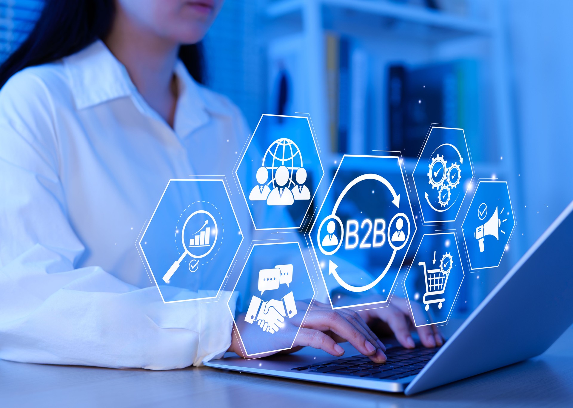 B2B business strategy concept. Business professional working with B2B interface on laptop, conceptualizing strategy, partnership, targets in business to business services. E-commerce, B2B Marketing,